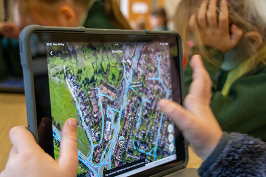 child using tablet in class